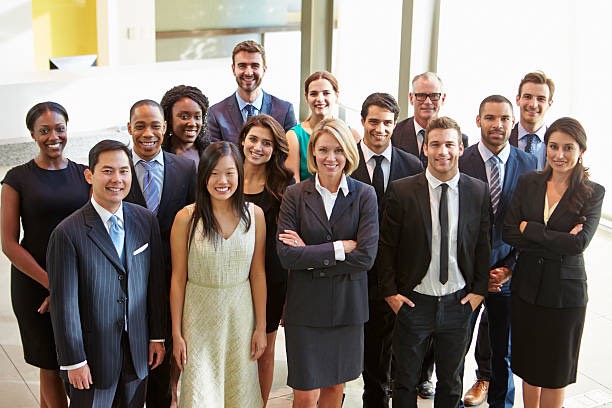 A group of people in suits and ties standing together.